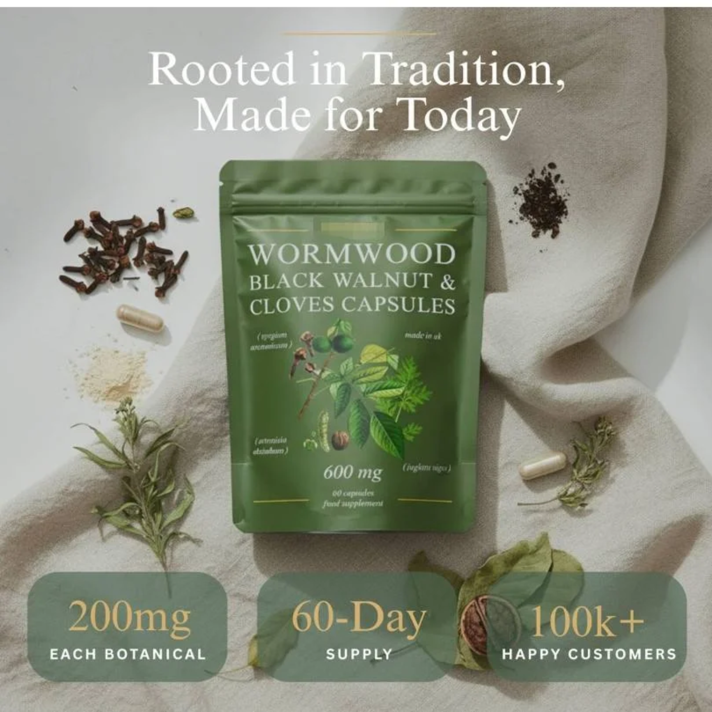 Wormwood, Black Walnut and Clove Capsules pouch photographed with whole cloves and fresh botanical leaves, labelled 200mg each botanical and 60-day supply